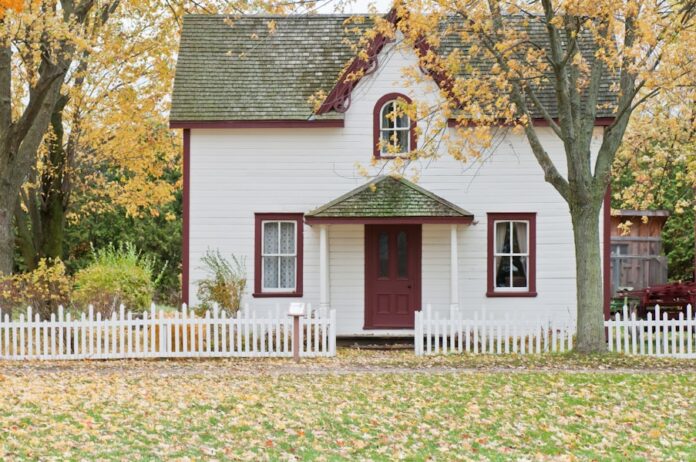 Photo by Scott Webb white house under maple trees
