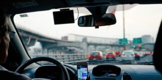 man driving vehicle with GPS system turned on