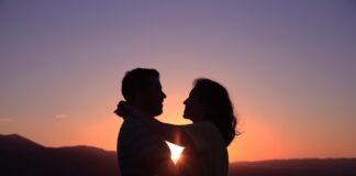 silhouette of hugging couple