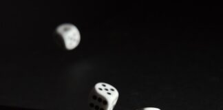 Global Gambling Industry Faces Stricter Regulation 3 white dice on black surface