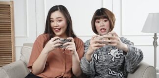 Exploring Non-gamstop Casinos a Gateway to Unrestricted Gaming Fun two women holding controllers sitting on sofa chair