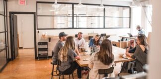 talking people sitting beside table