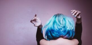 woman facing backward with blue hair