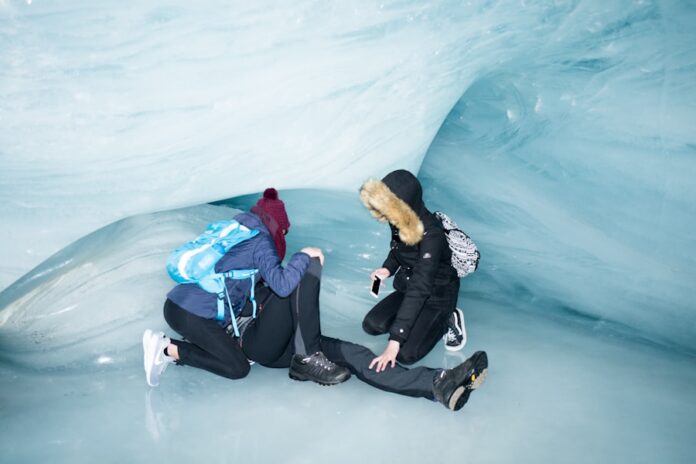 Photo by Mario Heller a couple of people that are sitting on some ice