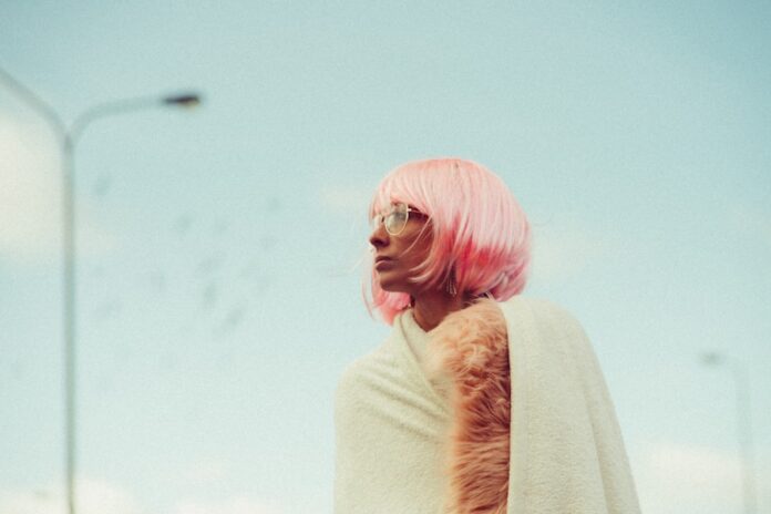 Photo by pawel szvmanski woman looking sideways near light post