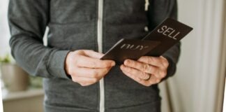 a person holding a cell phone in their hands