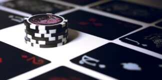 poker chip on white surface