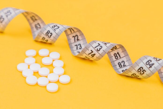 Photo by Diana Polekhina white round medication pill on yellow surface