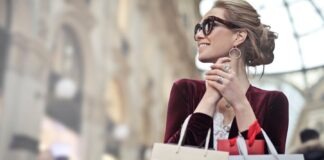 Stylish woman with shopping bags in Galleria Vittorio Emanuele II, Milan.