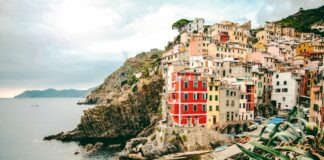 assorted-color buildings and body of water