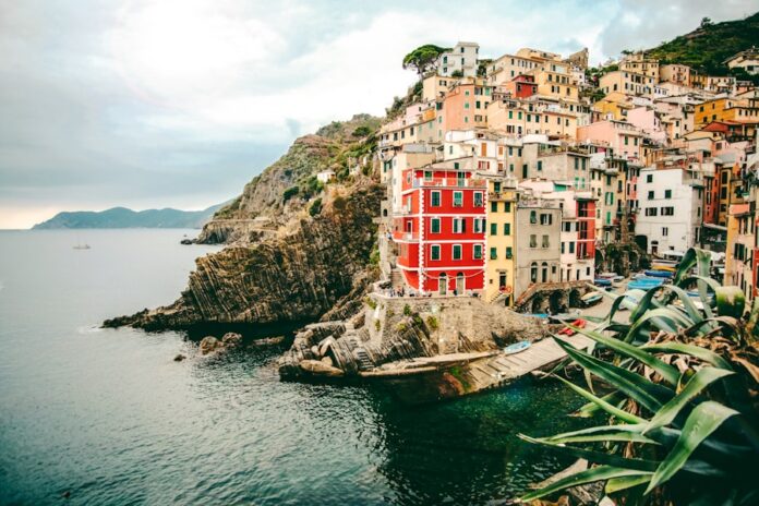 Photo by Cristina Gottardi assorted-color buildings and body of water