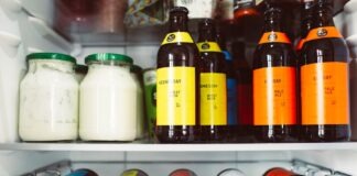 a refrigerator filled with lots of bottles of liquid