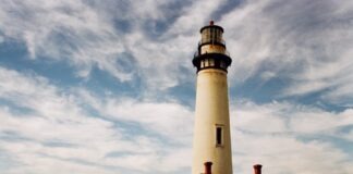 lighthouse near body of water