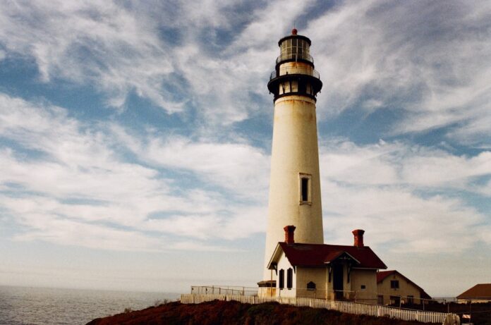 Photo by Randy Laybourne lighthouse near body of water