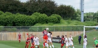 girls soccer team playing