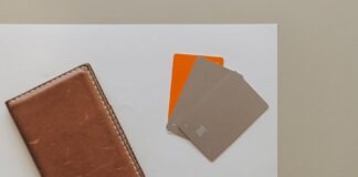 Why Every Tech-Savvy Professional Needs an RFID Minimalist Wallet A leather wallet and credit cards on a minimalist background, ideal for financial themes.