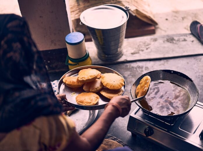 Photo by Ashwini Chaudhary(Monty) person cooking on black pan