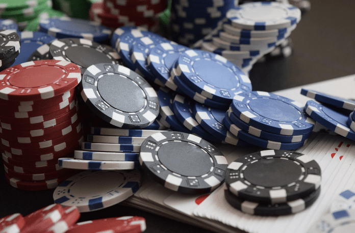 a-pile-of-poker-chips-ai-generated-content-may-be A pile of poker chips AI-generated content may be incorrect.
