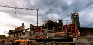 a construction site with a crane in the background