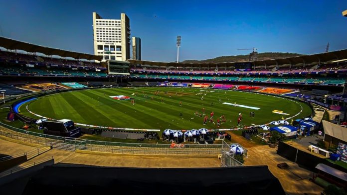Photo by Harsadh Vikhaas Rajesh Kumar a sports field with a crowd of people in the stands