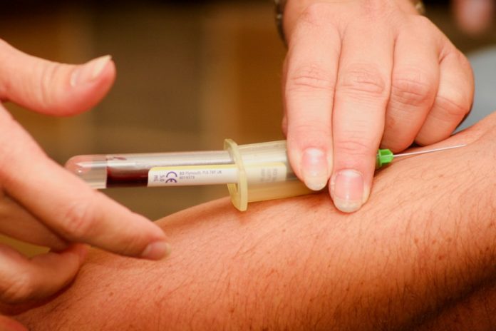 Photo by Hush Naidoo Jade Photography person injecting syringe