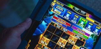 Do Return-to-Player (RTP) Percentages Actually Matter in Real Gameplay? Person playing a mobile gaming app on a tablet, focused on fun and entertainment.