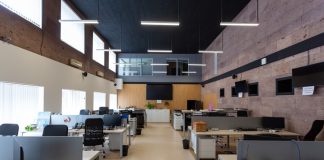 black flat screen computer monitor on white wooden desk