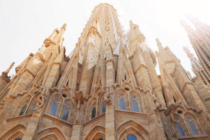 Photo by Tetyana Kovyrina Low angle view of the iconic Sagrada Familia, revealing its intricate architecture in Barcelona, Spain.