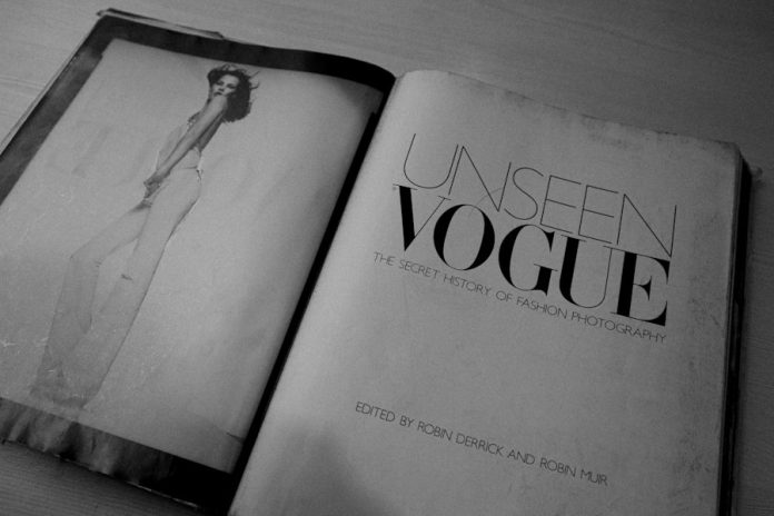 Photo by Simran Sood an open book with a picture of a woman in a dress
