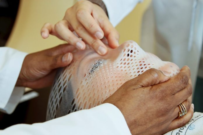 Photo by National Cancer Institute person holding man's face