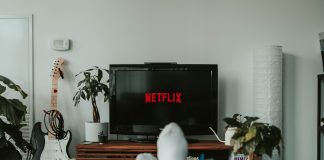 black flat screen tv turned on displaying 11