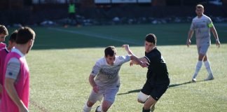 man playing soccer on the field