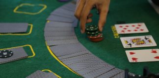 a person playing a game of cards on a table