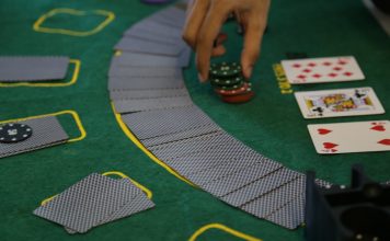a person playing a game of cards on a table
