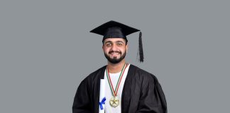 Studying Medicine in England – What Fascinates MBBS Students About the UK a man wearing a graduation cap and gown holding a book