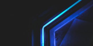 Choosing the Right LED Power Supply Factory for Reliable and Long-Term Business Growth Abstract close-up of neon blue light in dark setting, highlighting modern artistic design.