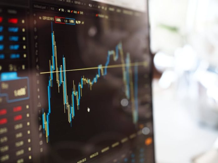 Photo by energepic.com Detailed view of financial trading graphs on a monitor, illustrating stock market trends.