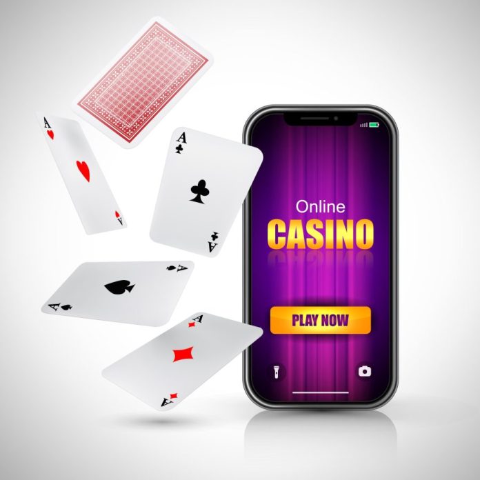 Online casino play now lettering on smart phone screen