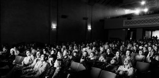 a black and white photo of a crowd of people