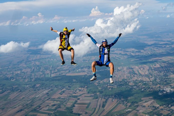 Photo by Kamil Pietrzak 2 men jumping on air