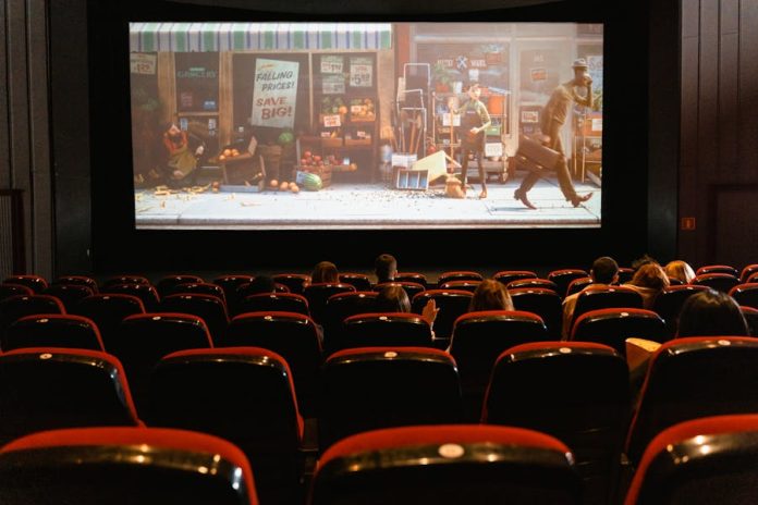 Photo by Tima Miroshnichenko A cozy indoor movie theater showing an animated film to a small audience.