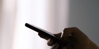person holding black android smartphone