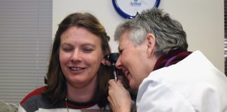 Why It’s Essential to Get the Right ENT Doctor a woman talking on a cell phone next to a man