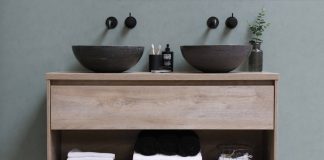 white and black ceramic bowl on brown wooden shelf