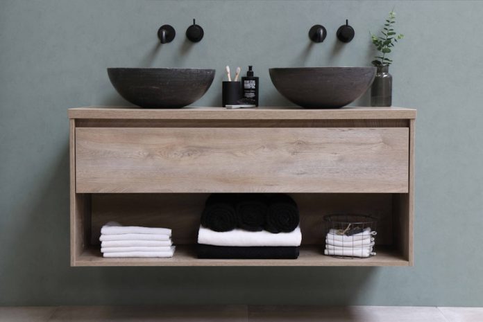 Photo by Sanibell BV white and black ceramic bowl on brown wooden shelf