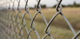 How Wire Fencing Protects Your Home and Land a close-up of a barbed wire fence