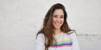 Trusted Platforms for Meeting Genuine Ukrainian Women Online a woman standing with her arms crossed in front of a white wall