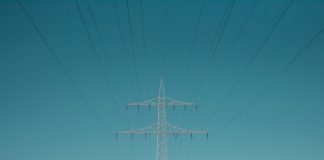 Advantages of Running the Company in the Global Energy Trade Space with Alkagesta LTD as a Satellite white electric post under blue sky during daytime