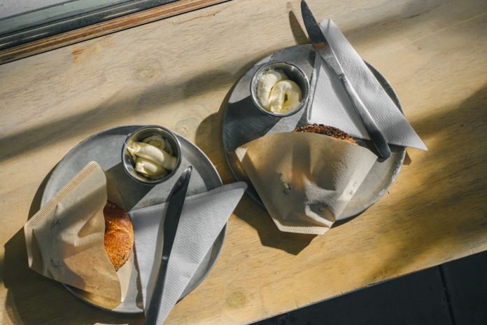 Photo by Kenny Kuo a couple of cups of food on a table