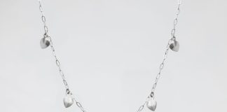 White Gold Chains That Turn Heads Without Trying Too Hard a silver heart necklace on a white background